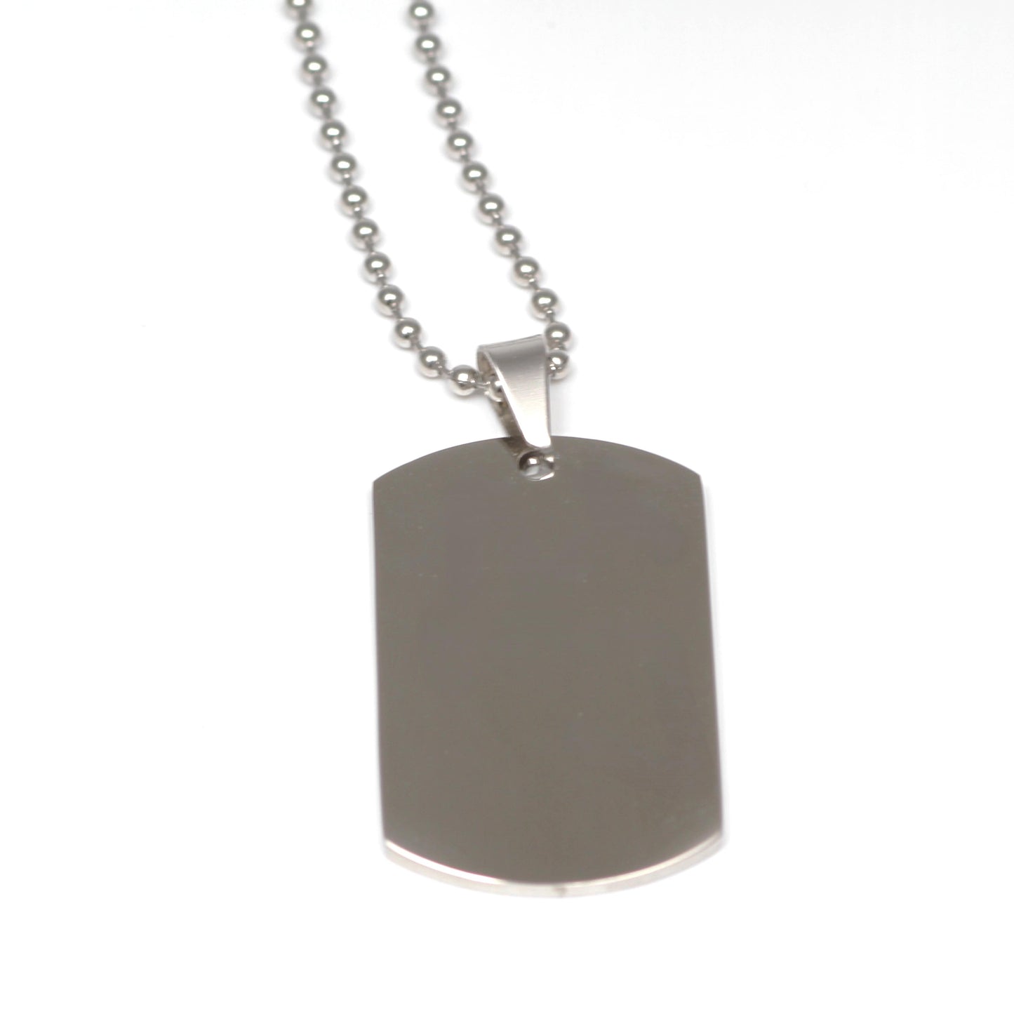 Silver dog tag necklace on a white background