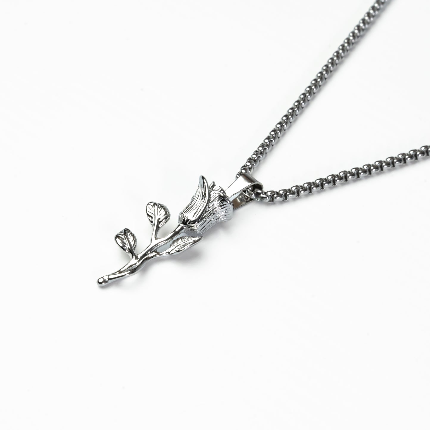 Close-up of silver rose necklace, water-resistant and tarnish-proof