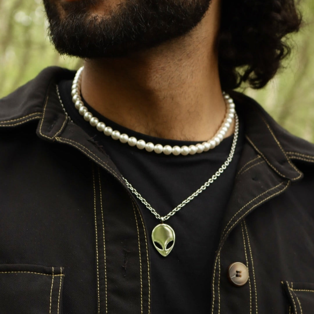 Pearl necklace with an alien pendant