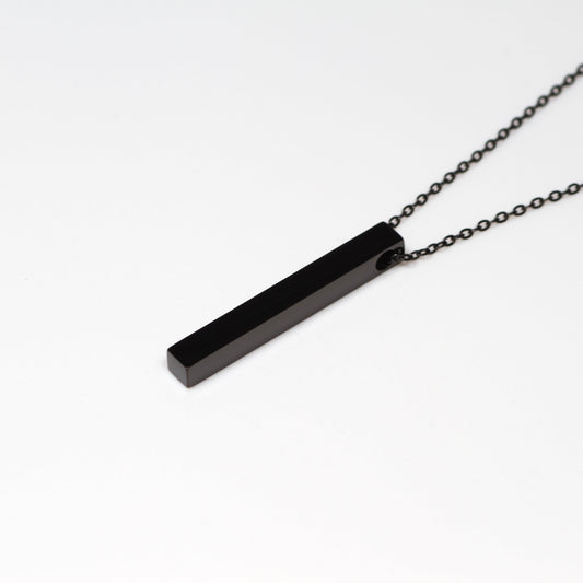 Black bar necklace on a white background