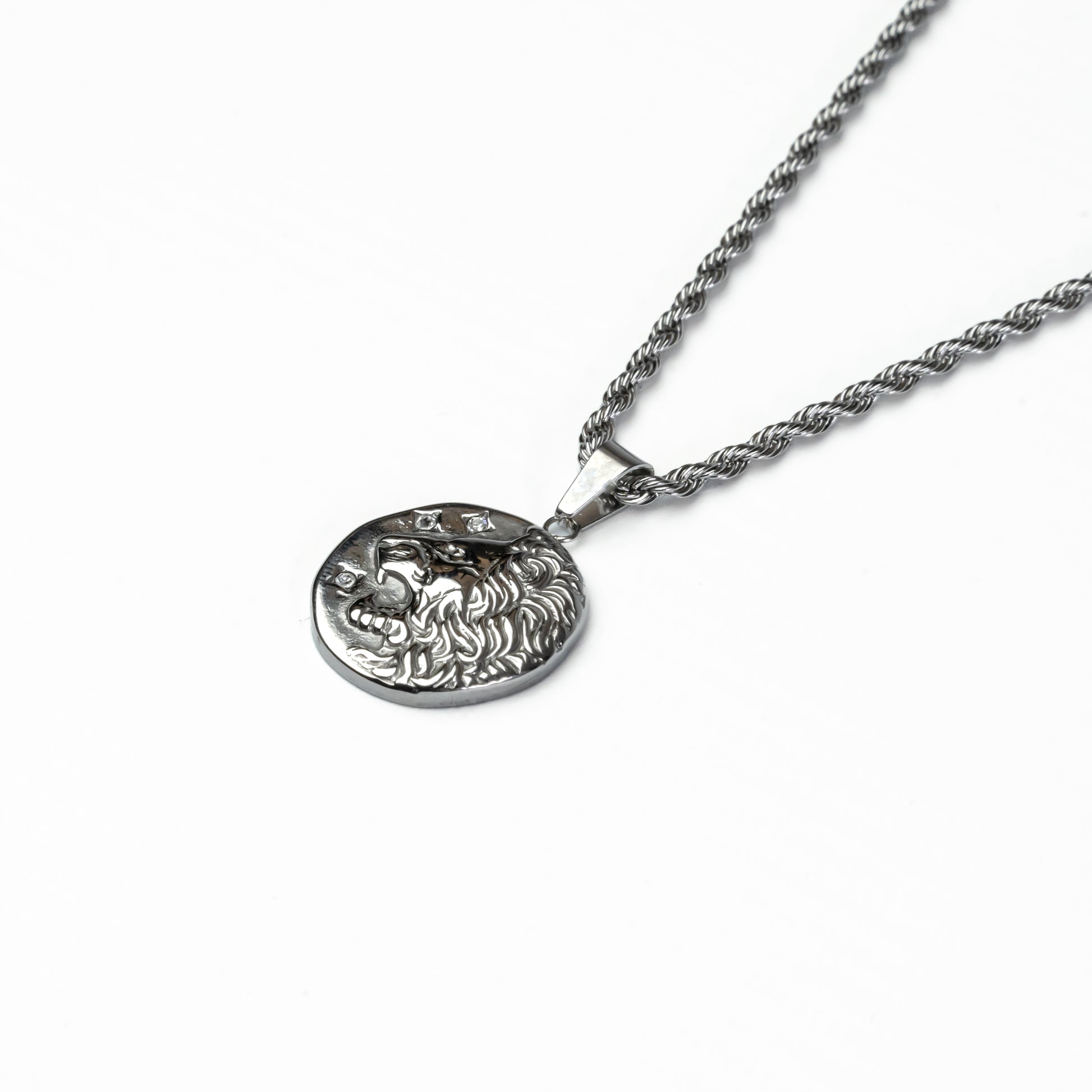Close-up of silver lion coin necklace, water-resistant and tarnish-proof