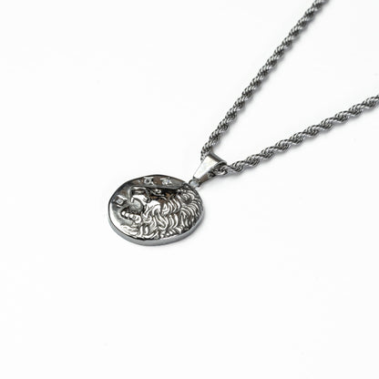 Close-up of silver lion coin necklace, water-resistant and tarnish-proof