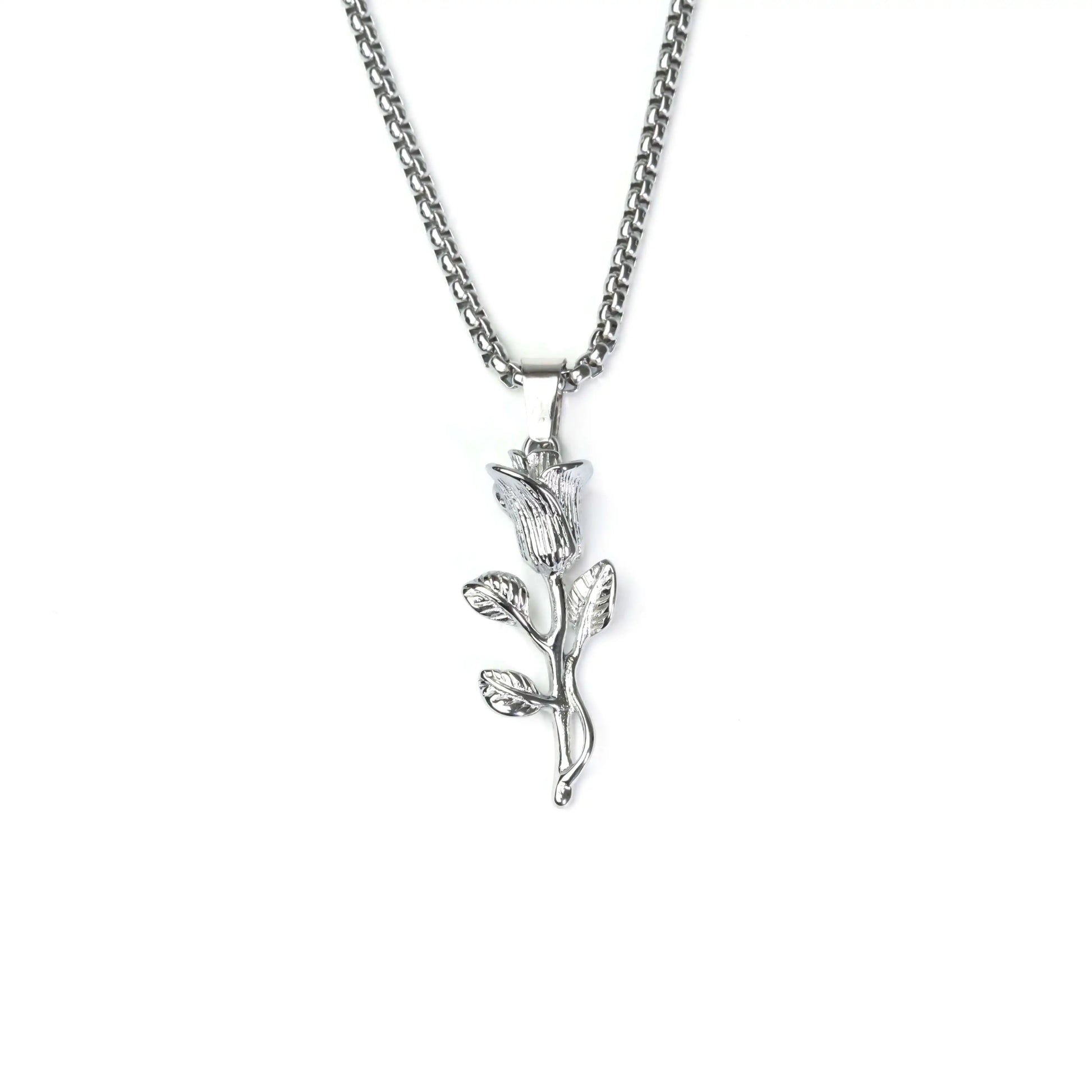 Silver necklace with a leaf-shaped pendant on a white background