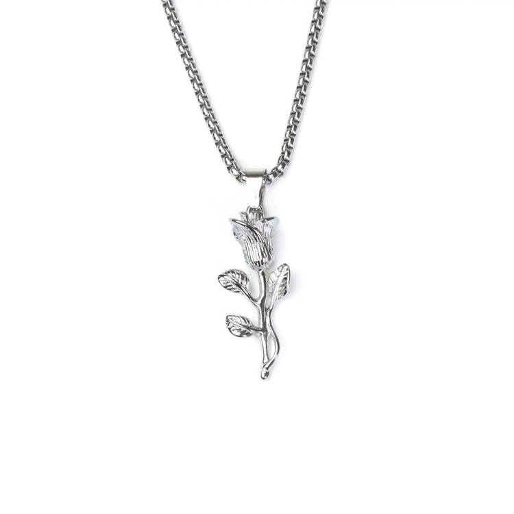 Silver necklace with a leaf-shaped pendant on a white background