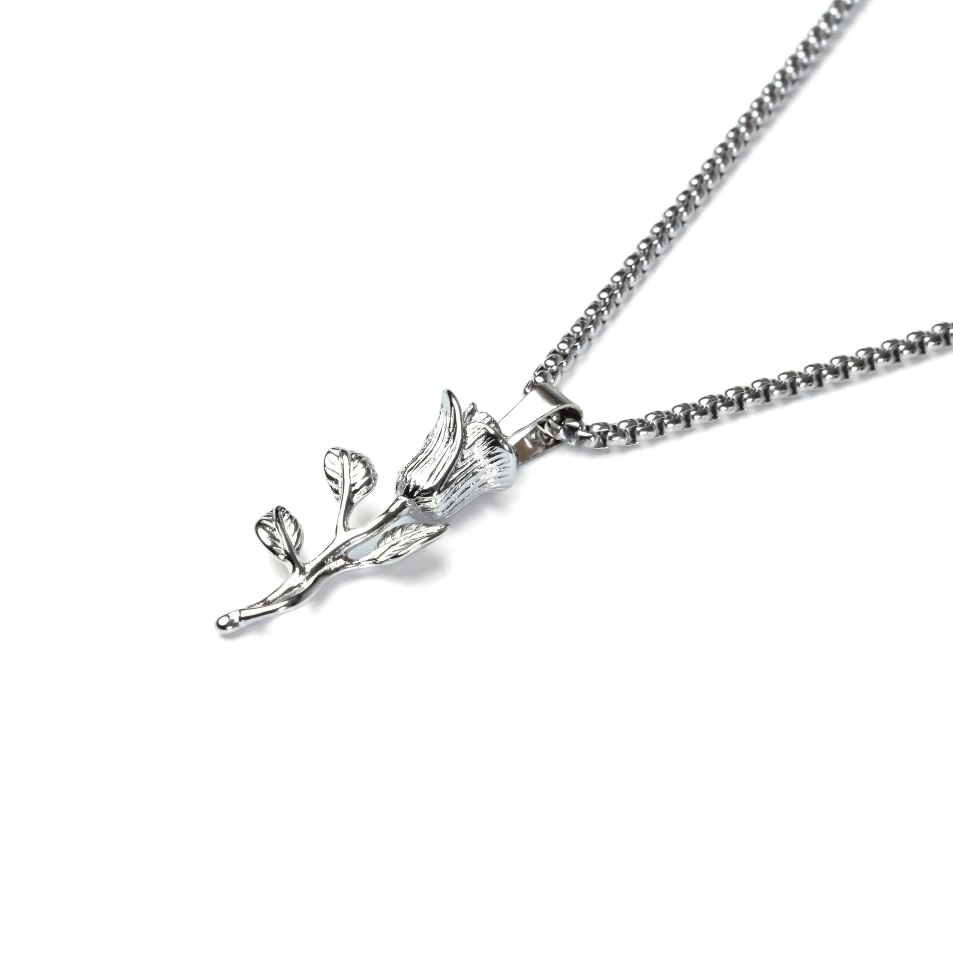 Silver necklace with a leaf-shaped pendant on a white background