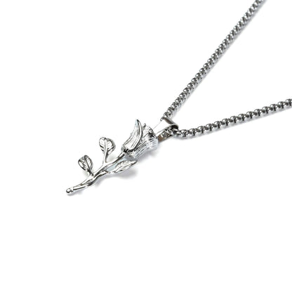 Silver necklace with a leaf-shaped pendant on a white background