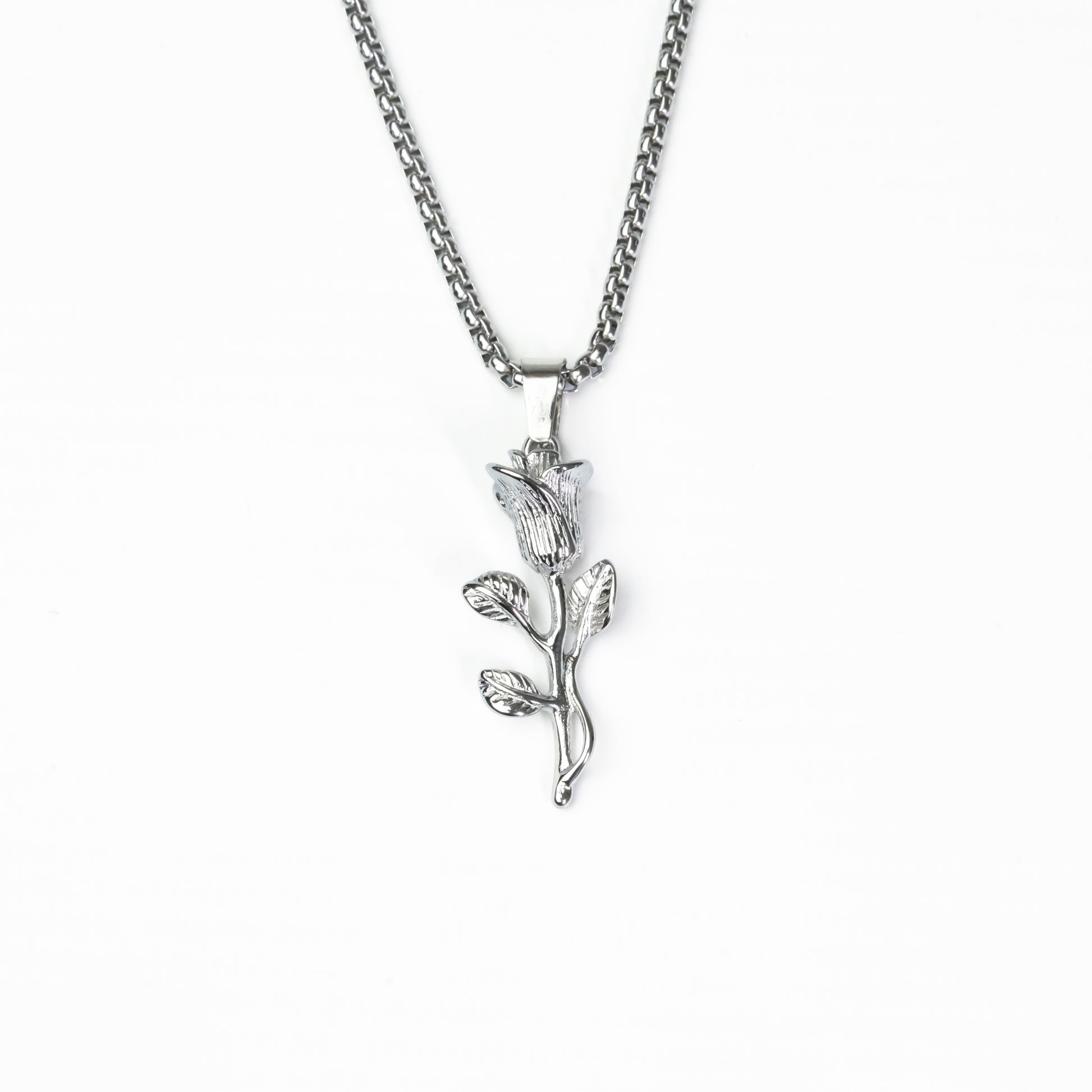 Silver rose pendant with detailed blooming rose design in stainless steel