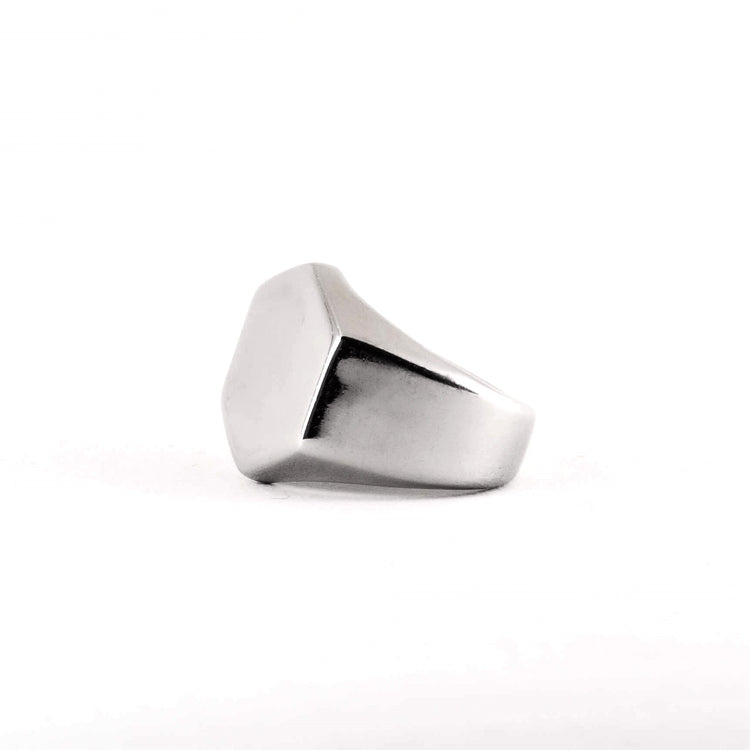 Silver thick ring on a white background