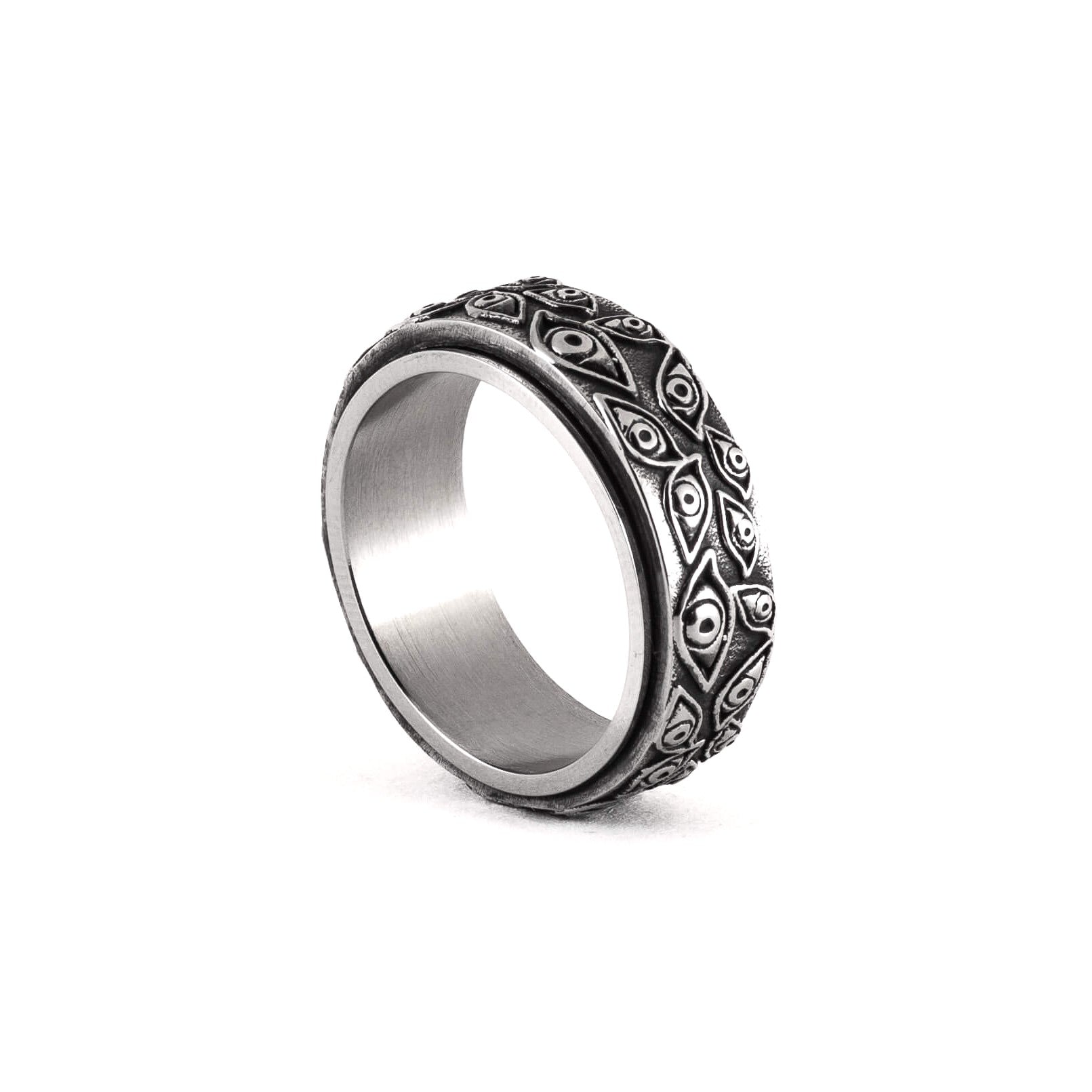 Silver ring with intricate design on a white background