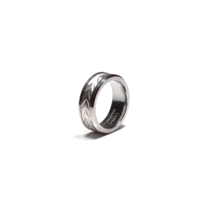 Silver ring with a reflective surface on a white background
