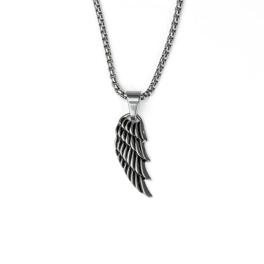 Silver wing pendant with detailed feather design in stainless steel